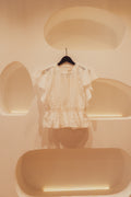 Summer blouse with embroidered details